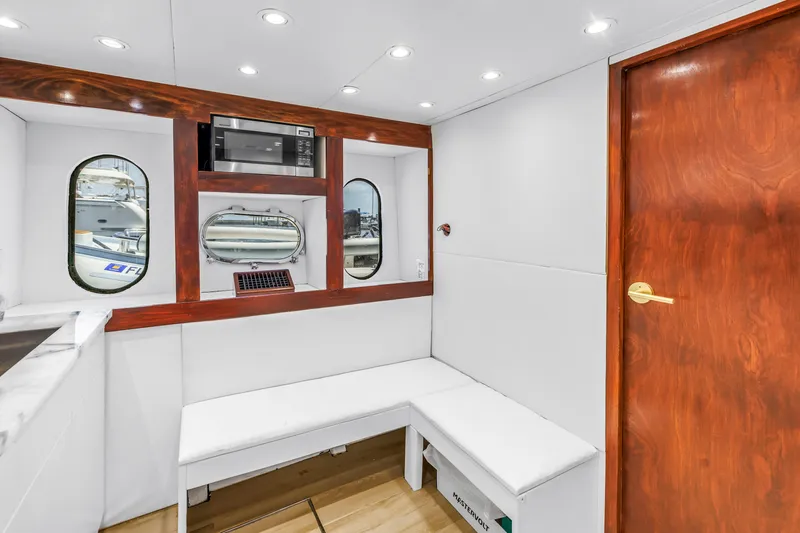 Star Saphire Yacht Photos Pics Luxurious Bilgin 117 yacht interior with white seating, wooden accents, and modern amenities, 2007 model.