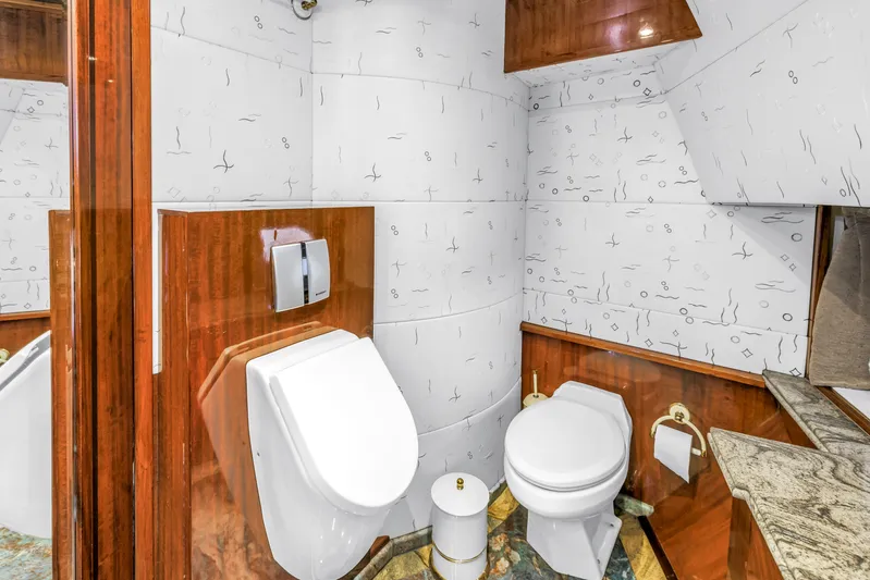 Star Saphire Yacht Photos Pics Luxurious bathroom in 2007 Bilgin 117 yacht with modern fixtures and elegant wood paneling.