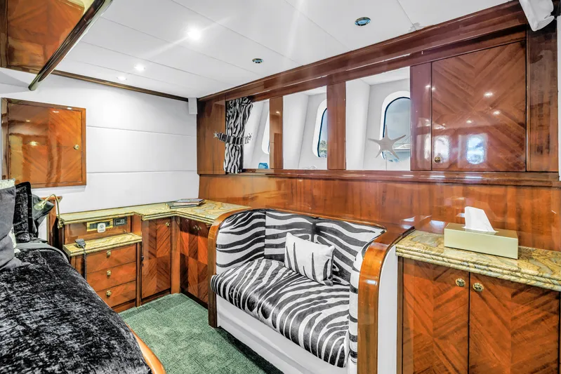 Star Saphire Yacht Photos Pics Luxurious Bilgin 117 yacht interior, featuring elegant wood paneling and zebra-patterned seating, 2007 model.