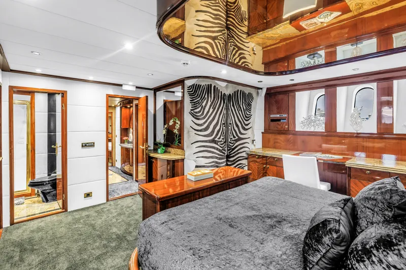 Star Saphire Yacht Photos Pics Luxurious Bilgin 117 yacht interior, featuring elegant wood finishes and zebra-patterned decor, 2007 model.