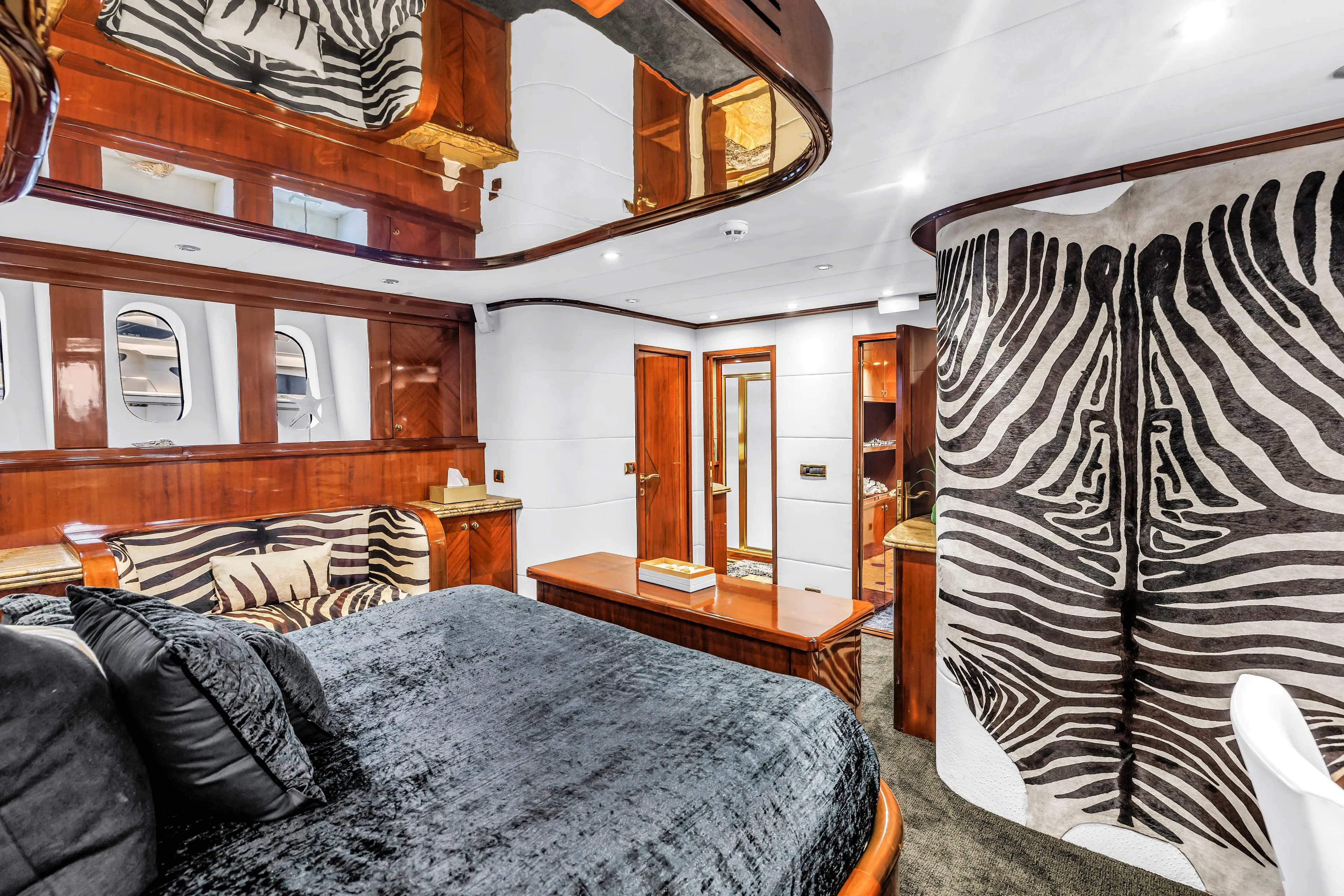 Star Saphire Yacht Photos Pics Luxurious Bilgin 117 yacht interior, featuring zebra print decor and elegant wood finishes, 2007 model.