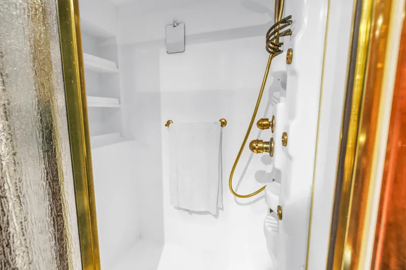 Star Saphire Yacht Photos Pics Luxurious shower with gold fixtures in a Bilgin 117 yacht, 2007 model.