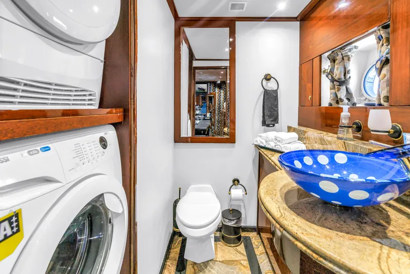 Star Saphire Yacht Photos Pics Luxurious Bilgin 117 yacht bathroom with washer, dryer, and elegant blue glass sink, 2007 model.