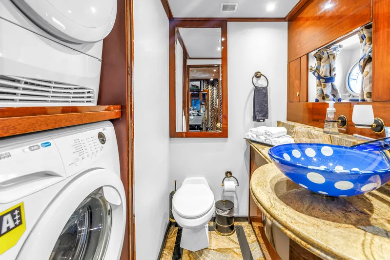 Star Saphire Yacht Photos Pics Luxurious yacht bathroom with washer, vibrant blue sink, and elegant wood accents, Bilgin 117, 2007.