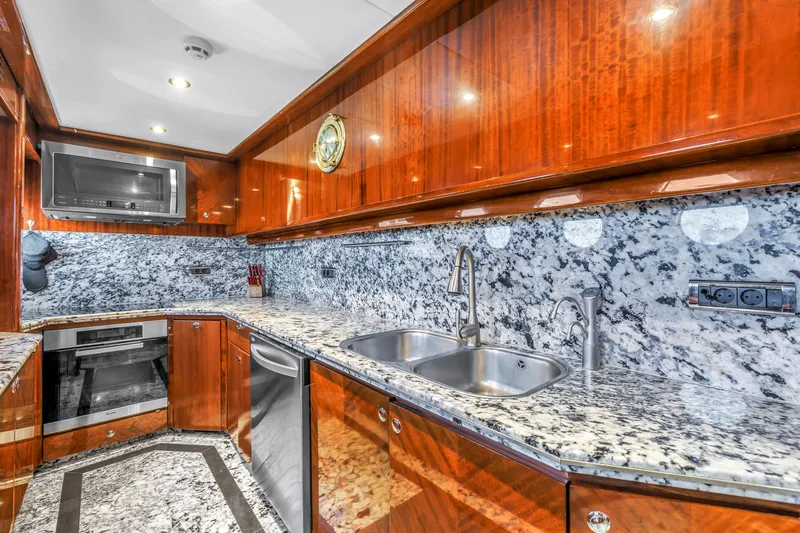 Star Saphire Yacht Photos Pics Luxurious yacht kitchen with granite countertops, stainless steel appliances, and wooden cabinetry, Bilgin 117, 2007.