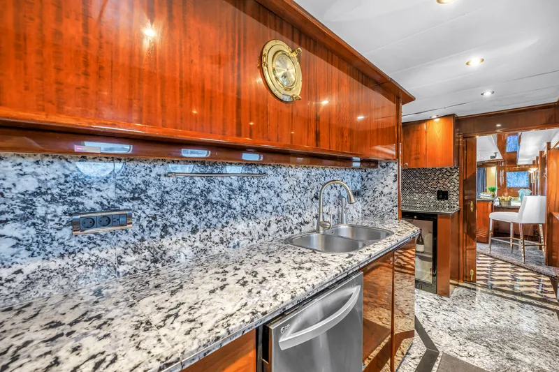Star Saphire Yacht Photos Pics Luxurious yacht kitchen with granite countertops, Bilgin 117 model, 2007, featuring wood cabinetry and modern fixtures.