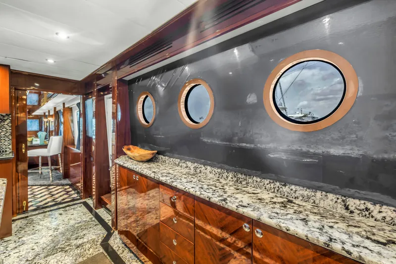 Star Saphire Yacht Photos Pics Luxurious interior of 2007 Bilgin 117 yacht with granite countertops and porthole windows.