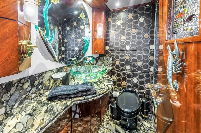 Star Saphire Yacht Photos Pics Luxurious Bilgin 117 yacht bathroom, 2007 model, featuring elegant stone countertops and unique decor.