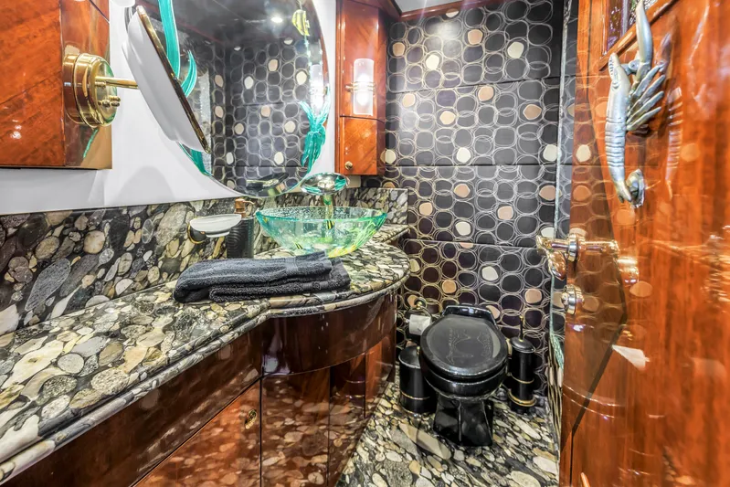 Star Saphire Yacht Photos Pics Luxurious Bilgin 117 yacht bathroom with elegant stone countertops and modern glass sink, 2007 model.