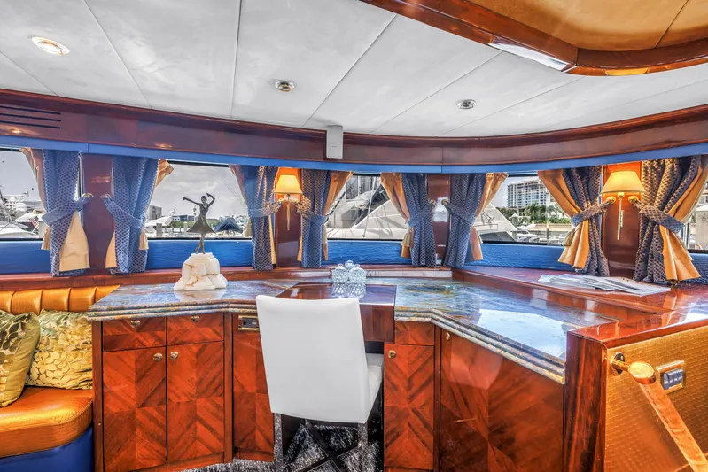 Star Saphire Yacht Photos Pics Luxurious interior of 2007 Bilgin 117 yacht with elegant wood finish and scenic windows.