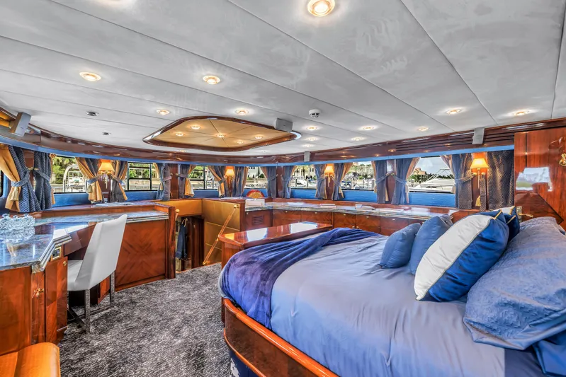 Star Saphire Yacht Photos Pics Luxurious interior of 2007 Bilgin 117 yacht with elegant wood finishes and plush bedding.