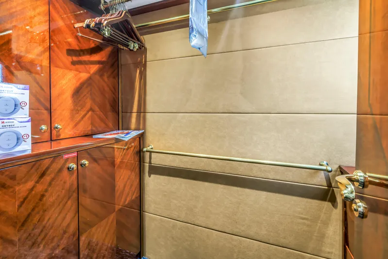 Star Saphire Yacht Photos Pics Luxurious wooden closet interior with hangers, brass railings, and smoke detectors, Bilgin 117 yacht, 2007.