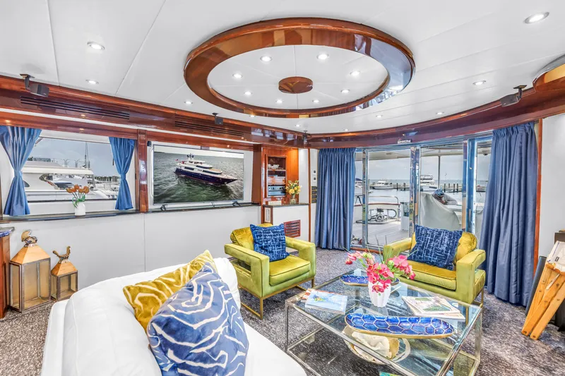 Star Saphire Yacht Photos Pics Luxurious 2007 Bilgin 117 yacht interior with elegant seating, vibrant decor, and large windows.