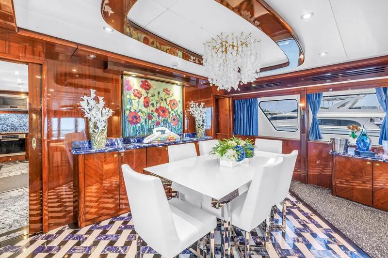 Star Saphire Yacht Photos Pics Luxurious Bilgin 117 yacht interior, featuring elegant dining area with chandelier and floral decor, 2007 model.
