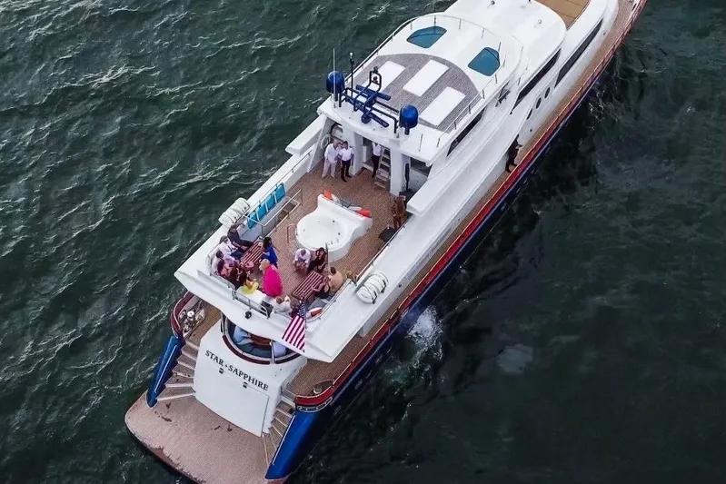 Star Saphire Yacht Photos Pics Aerial view of 2007 Bilgin 117 yacht with people on deck, cruising on the ocean.