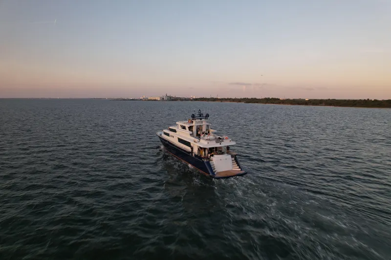 Star Saphire Yacht Photos Pics Luxury yacht Bilgin 117 cruising at sunset, 2007 model, on open water.