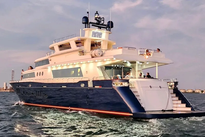 Star Saphire Yacht Photos Pics Luxurious 2007 Bilgin 117 yacht cruising at sunset with passengers on deck.