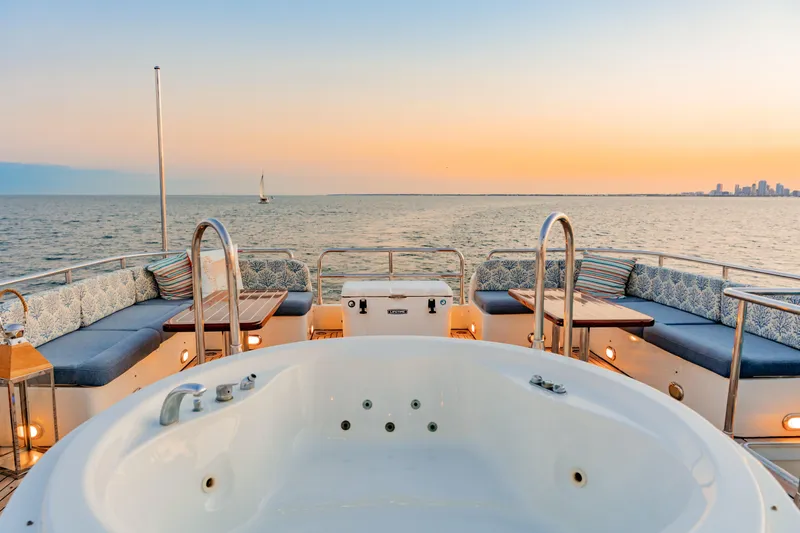 Star Saphire Yacht Photos Pics Luxurious Bilgin 117 yacht deck with jacuzzi, ocean view, and sunset, 2007 model.