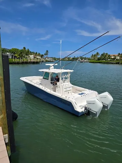  Yacht Photos Pics 2023 Caymas 30 CT boat on a sunny day in a scenic waterway.