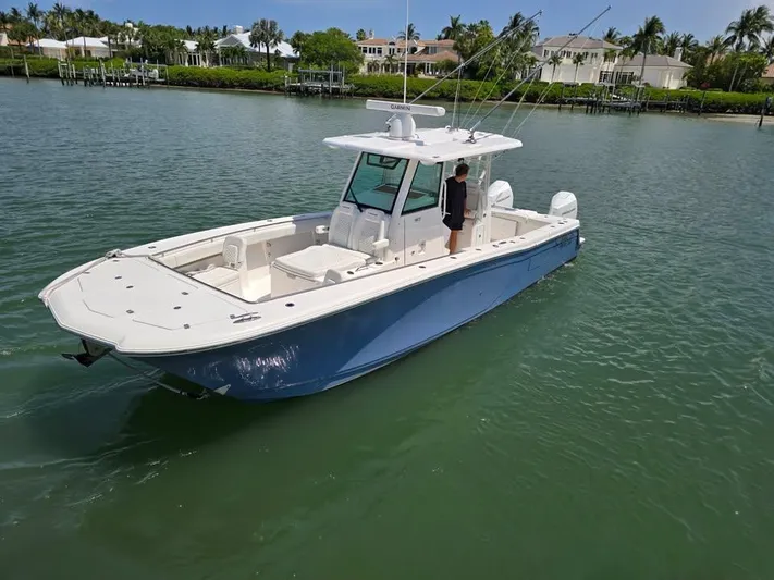  Yacht Photos Pics 2023 Caymas 30 CT boat on calm water, featuring sleek design and spacious deck.