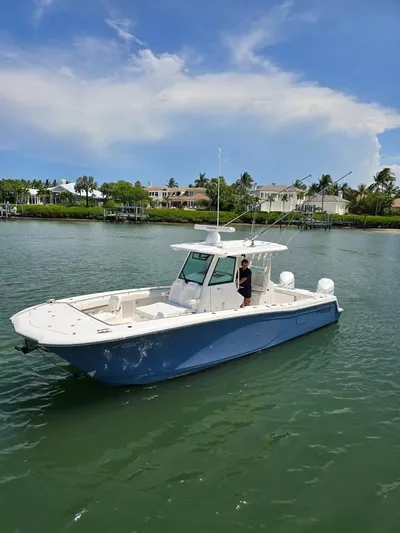  Yacht Photos Pics 2023 Caymas 30 CT boat on calm water with scenic background.