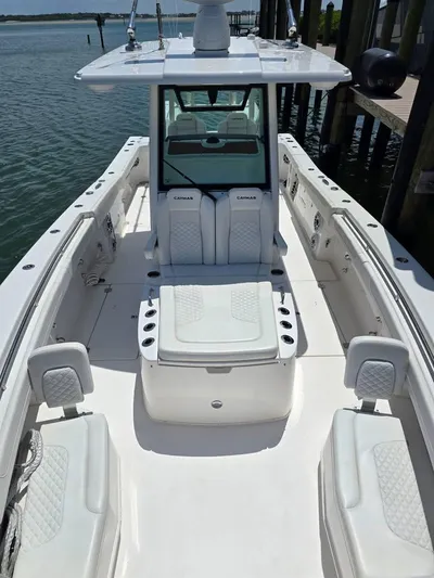  Yacht Photos Pics 2023 Caymas 30 CT boat with spacious seating and sleek design on the water.