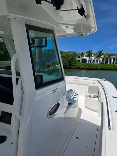  Yacht Photos Pics 2023 Caymas 30 CT boat on water, featuring sleek design and modern amenities.