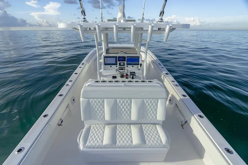  Yacht Photos Pics Manufacturer Provided Image: 2023 Invincible 33 Catamaran on calm ocean waters, featuring luxurious seating and advanced navigation systems.