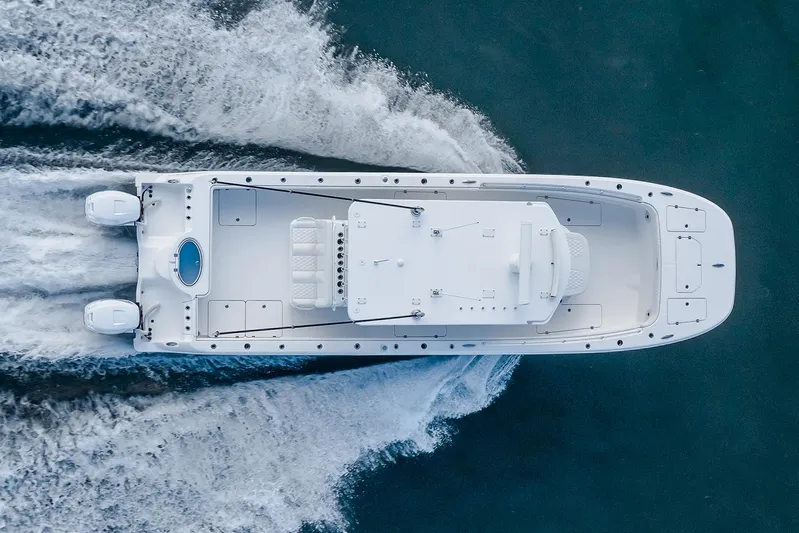  Yacht Photos Pics Manufacturer Provided Image: 2025 Invincible 33 Catamaran cruising on water, aerial view, showcasing sleek design and powerful engines.