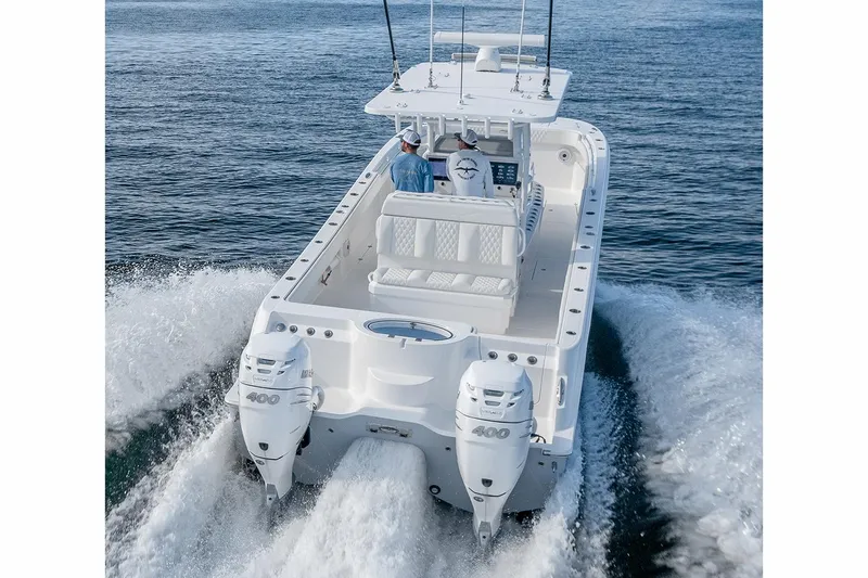  Yacht Photos Pics Manufacturer Provided Image: 2023 Invincible 33 Catamaran cruising on open water, showcasing twin engines and sleek design.