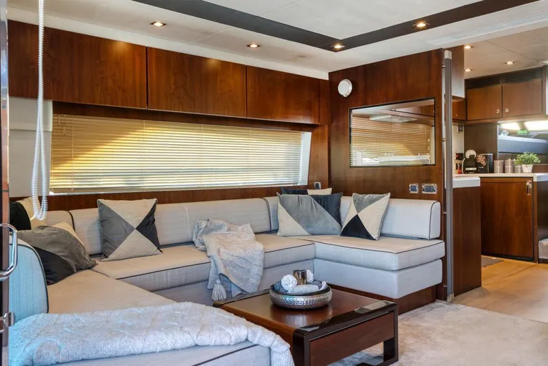  Yacht Photos Pics Luxurious interior of 2016 Fairline Squadron 65 yacht with elegant seating and modern decor.