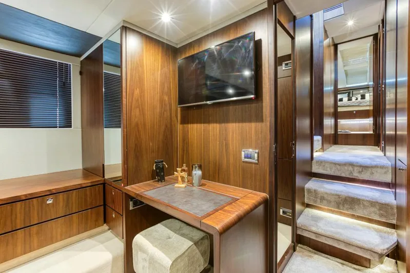  Yacht Photos Pics Luxurious interior of 2016 Fairline Squadron 65 yacht with wood paneling and modern amenities.