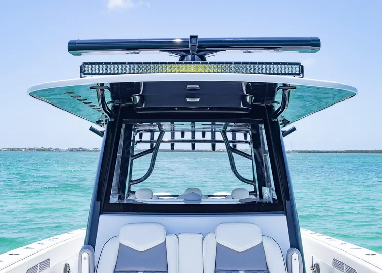  Yacht Photos Pics 2026 Invincible 38 Catamaran on clear blue water, showcasing sleek design and modern features.