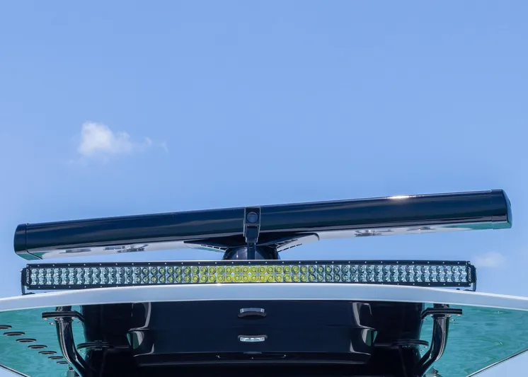  Yacht Photos Pics 2026 Invincible 38 Catamaran with advanced radar and light bar against clear blue sky.