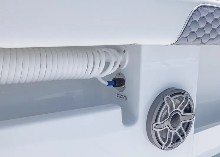  Yacht Photos Pics 2026 Invincible 38 Catamaran detail: coiled hose and speaker on deck.