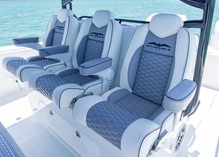  Yacht Photos Pics 2026 Invincible 38 Catamaran luxury seating with gray and white upholstery on open water.