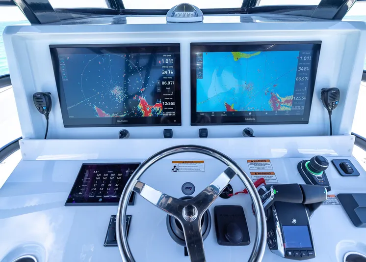  Yacht Photos Pics Cockpit of 2026 Invincible 38 Catamaran with dual navigation screens and steering wheel.