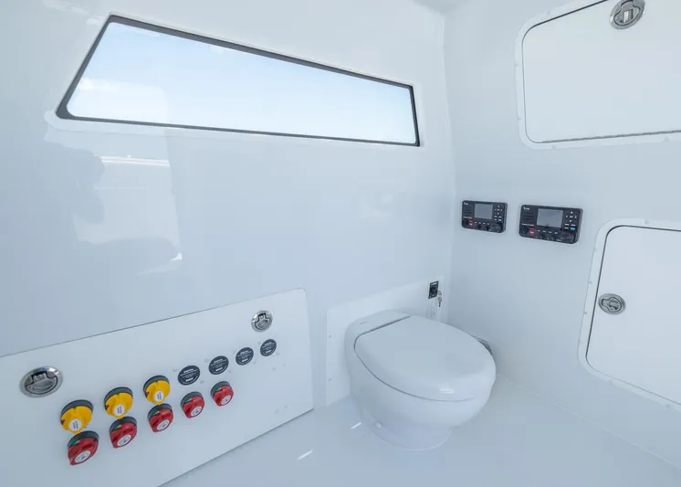  Yacht Photos Pics 2026 Invincible 38 Catamaran interior with modern controls and marine toilet.