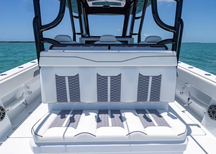  Yacht Photos Pics 2026 Invincible 38 Catamaran interior with luxurious seating, ocean backdrop.