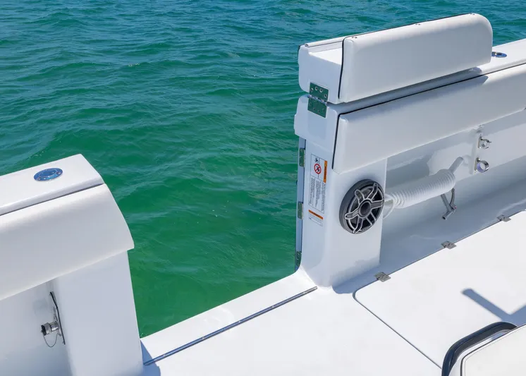  Yacht Photos Pics 2026 Invincible 38 Catamaran deck with white seating, speaker, and ocean view.