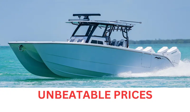  Yacht Photos Pics 2026 Invincible 38 Catamaran cruising on turquoise water with "Unbeatable Prices" text.