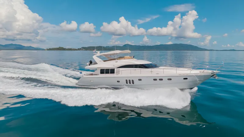 Blue Rose Yacht Photos Pics Luxury Princess 23M yacht cruising on calm blue waters under a clear sky.