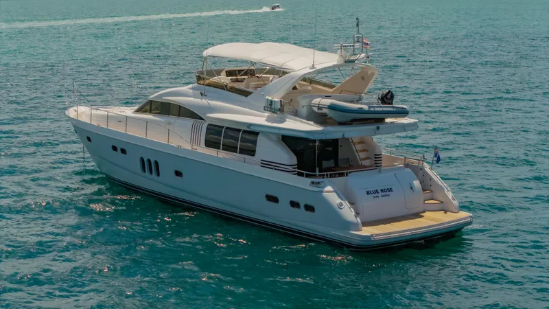 Blue Rose Yacht Photos Pics Luxury Princess 23M yacht from 2006 cruising on clear blue waters.