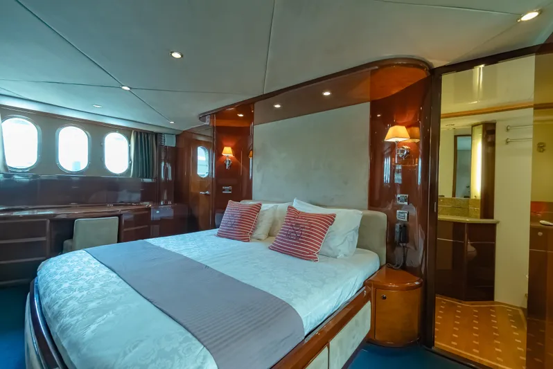 Blue Rose Yacht Photos Pics Luxurious cabin interior of 2006 Princess 23M yacht with elegant wood finishes.