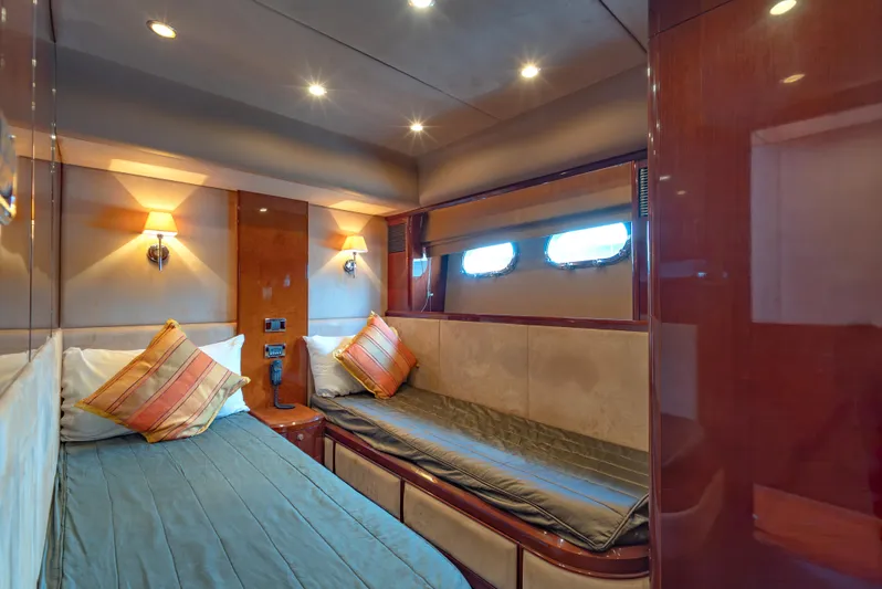 Blue Rose Yacht Photos Pics Luxurious cabin interior of 2006 Princess 23M yacht with twin beds and elegant lighting.