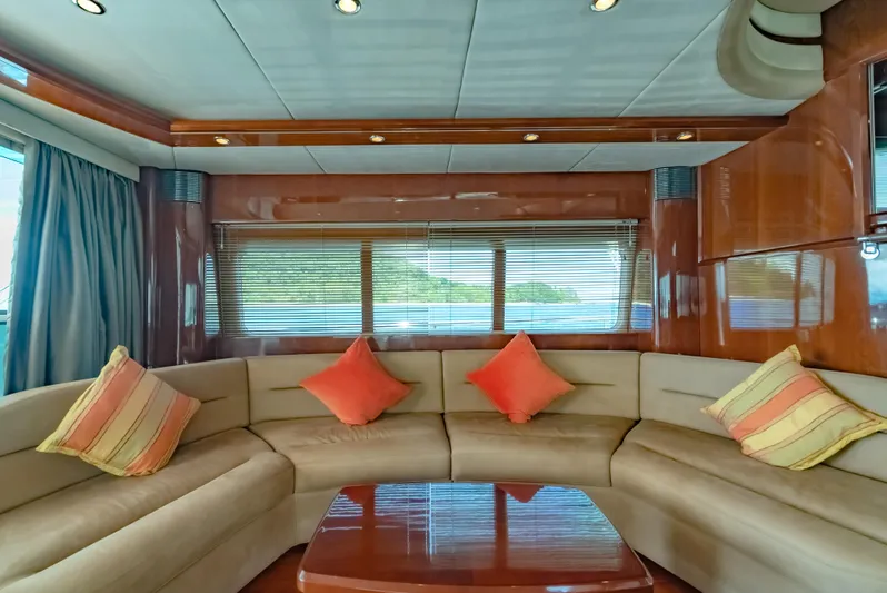 Blue Rose Yacht Photos Pics Luxurious interior of 2006 Princess 23M yacht with plush seating and decorative cushions.