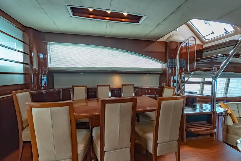Blue Rose Yacht Photos Pics Luxurious dining area inside a 2006 Princess 23M yacht with elegant seating and modern design.