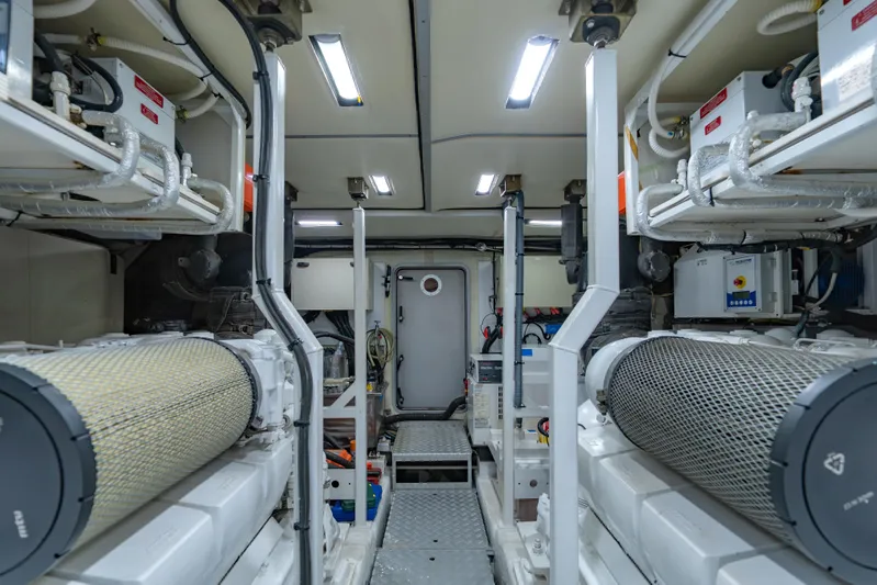 Blue Rose Yacht Photos Pics Engine room of a 2006 Princess 23M yacht, featuring dual engines and modern equipment.