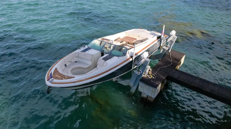 Minsky's Folly II Yacht Photos Pics 2014 Chris-Craft Launch 32 boat docked on clear blue water.