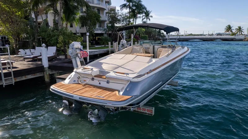 Minsky's Folly II Yacht Photos Pics 2014 Chris-Craft Launch 32 boat docked in tropical waters.